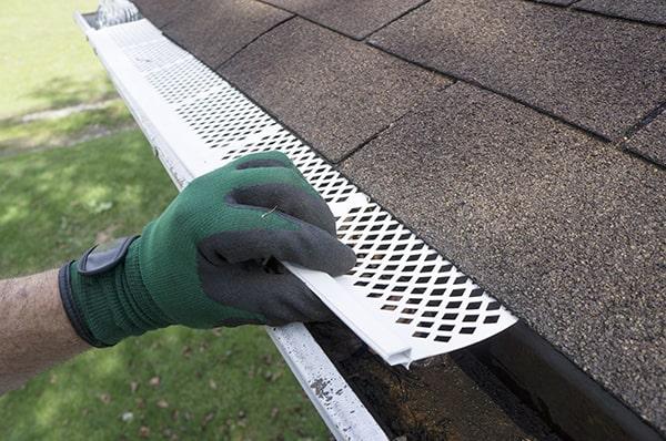 gutter guards are designed to handle heavy rainfall by allowing water to flow through while keeping debris out